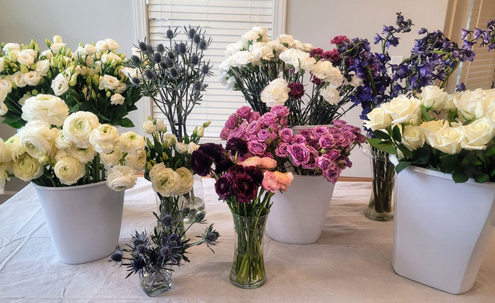 bulk wedding flowers white blush red roses carnations small flowers accent flowers loose bunches arrangement